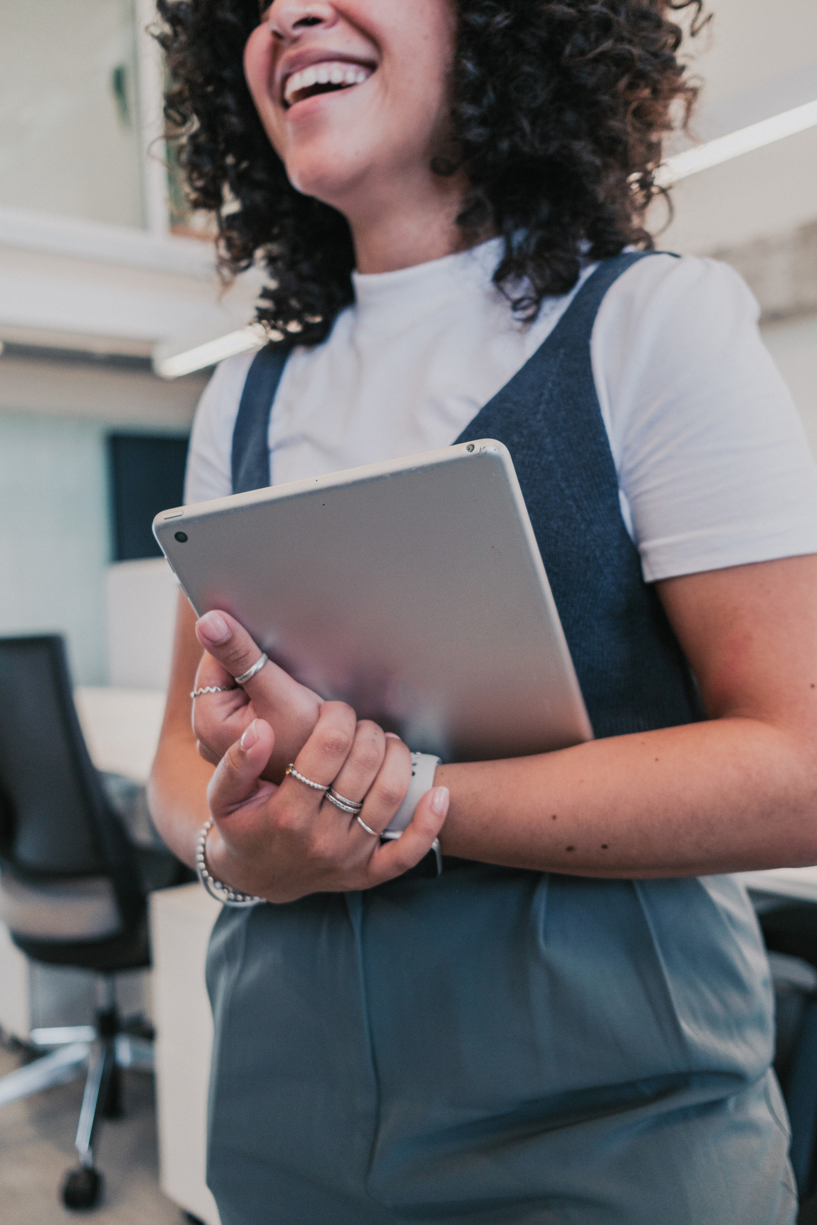 Cool Corporate Woman Holding a Tablet in an Office